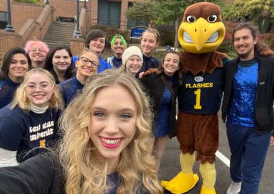A group selfie taken with the Flash at the 2022 Homecoming Parade.